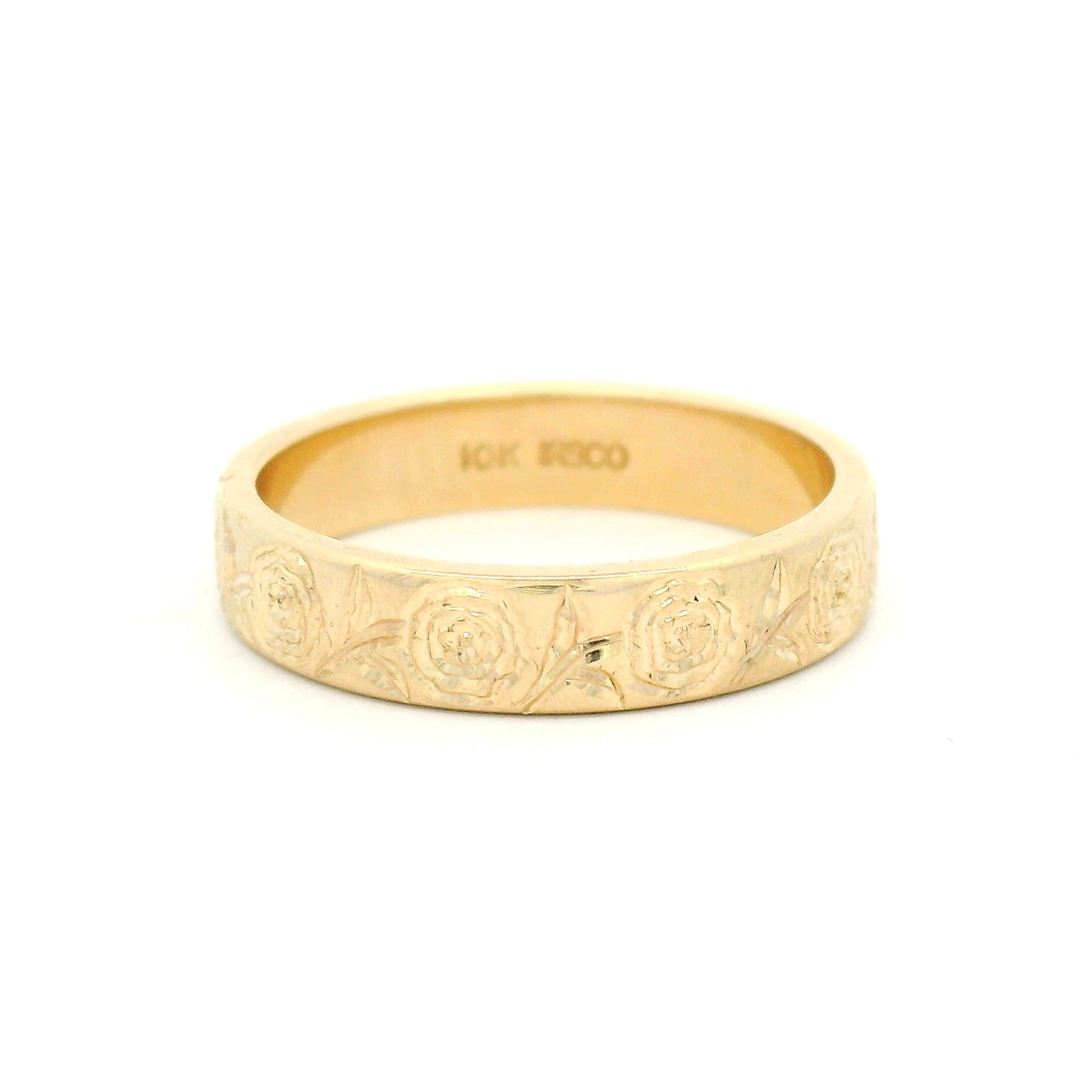 10K yellow gold 4mm soft domed wedding band with hand-engraved peony floral design covering two-thirds of the band.