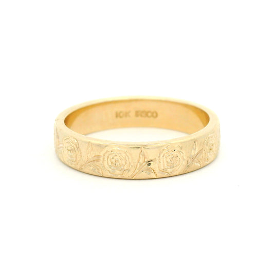 10K yellow gold 4mm soft domed wedding band with hand-engraved peony floral design covering two-thirds of the band.
