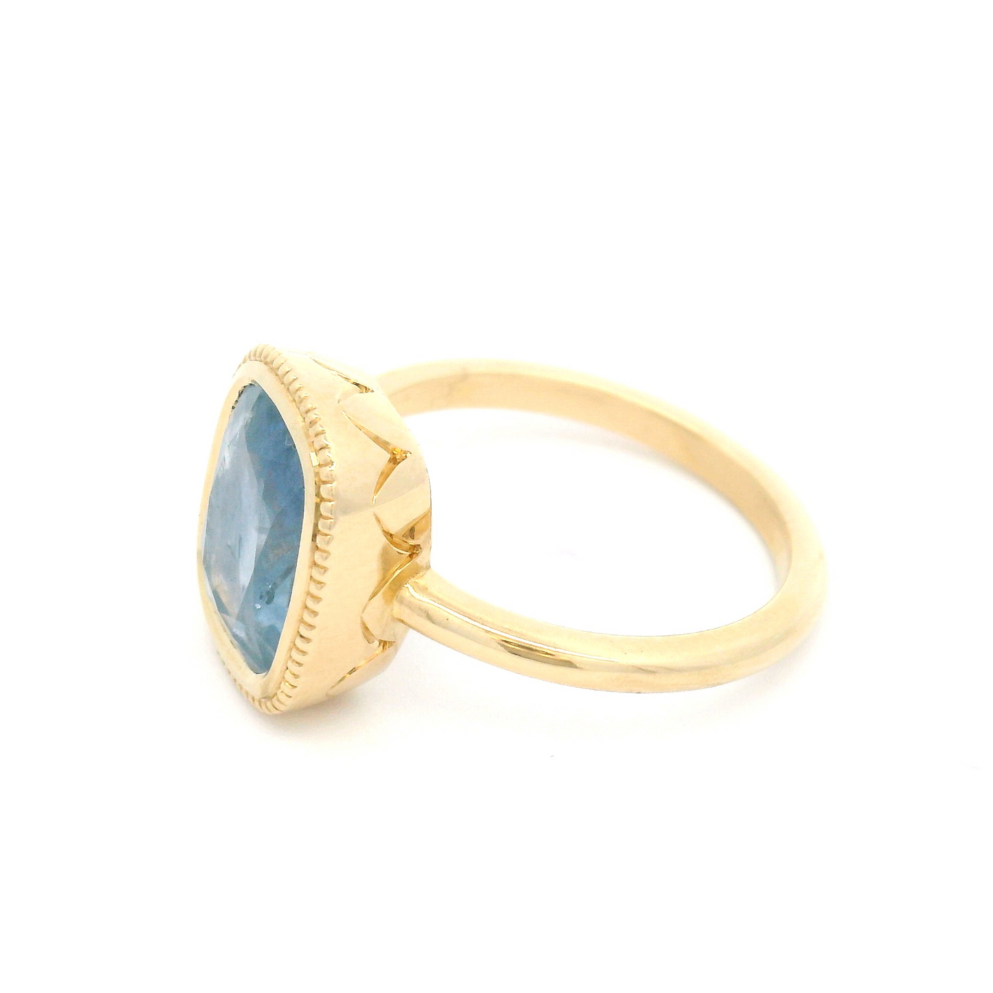 10k Yellow Bezel-Set Solitaire with 3.75ct Cushion-Cut Light Blue Sapphire Accented with Hand-Engraving