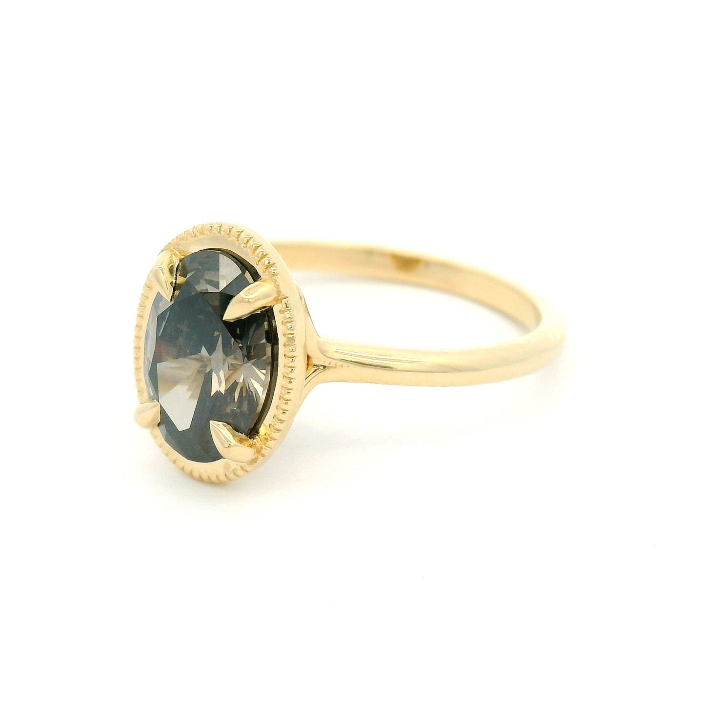 14K yellow gold solitaire engagement ring featuring a 1.55ct lab-grown oval-cut grey diamond in four-claw setting with milgrain edge and 1.8mm band.