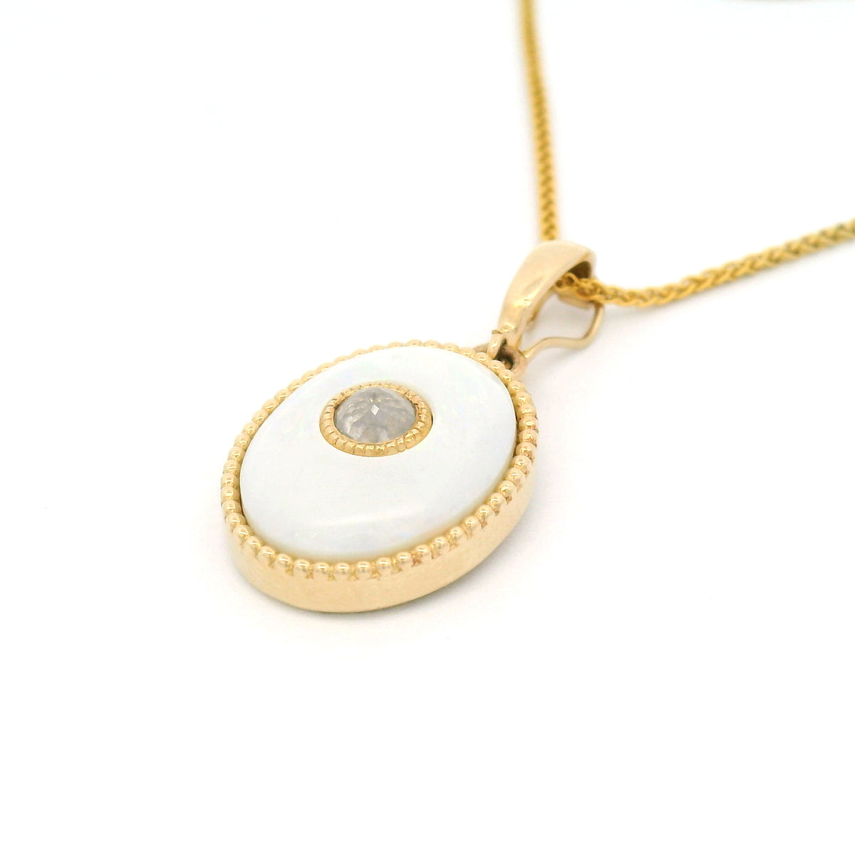 14K yellow gold pendant featuring a natural 1.15ct cabochon opal with a beaded bezel edge, centre-set 0.20ct rose-cut diamond and hinged bail.