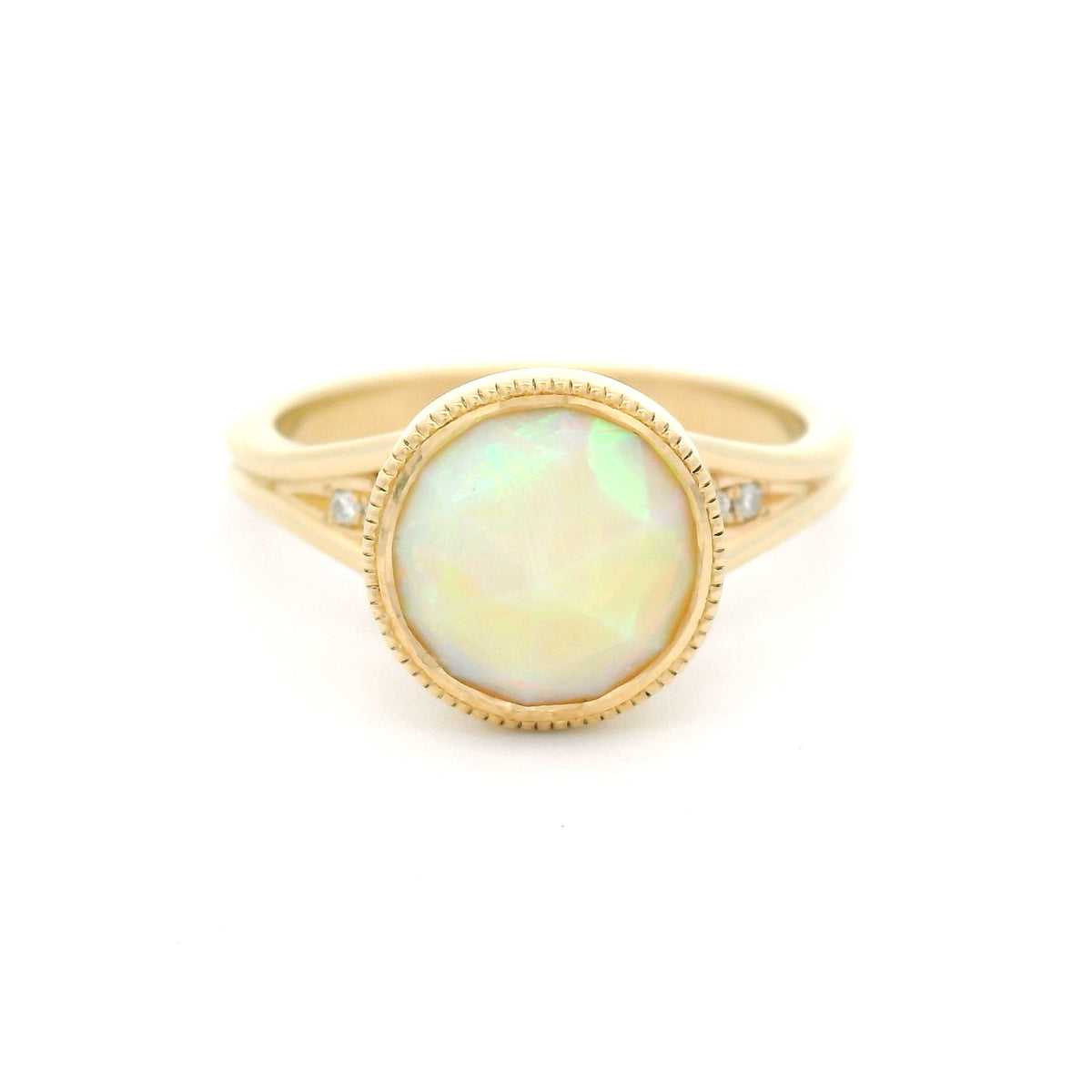 14K yellow gold engagement ring featuring a bezel-set natural 1.13ct round rose-cut opal with milgrain detail and hidden 0.06ct natural diamond accents.