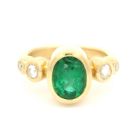 18k yellow gold ring with 1.70ct natural oval emerald and accent diamonds.