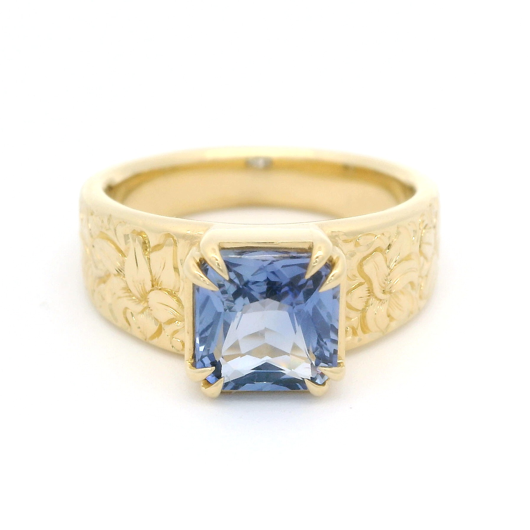 18k Yellow Gold Ring with 2.06ct Blue Sapphire and hand engraved lilies.