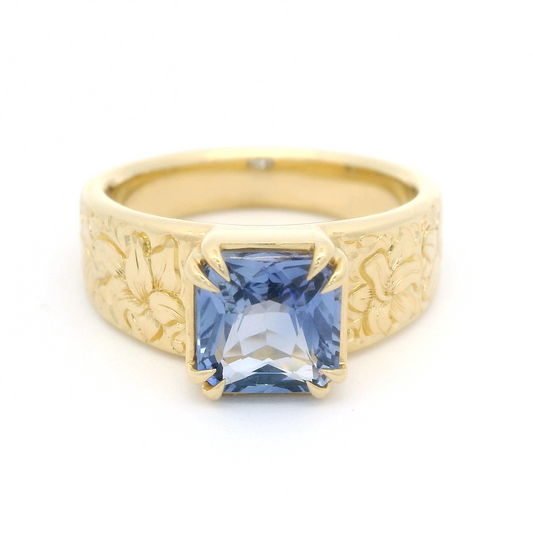 18k Yellow Gold Ring with 2.06ct Blue Sapphire and hand engraved lilies.