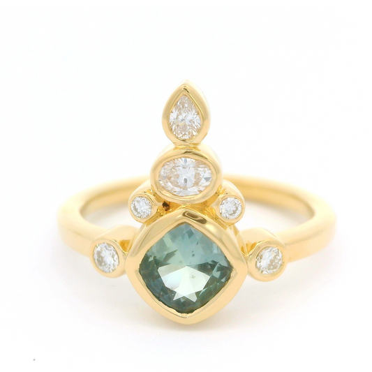 18k yellow ring 0.68ct teal sapphire and fancy shape accent diamonds.