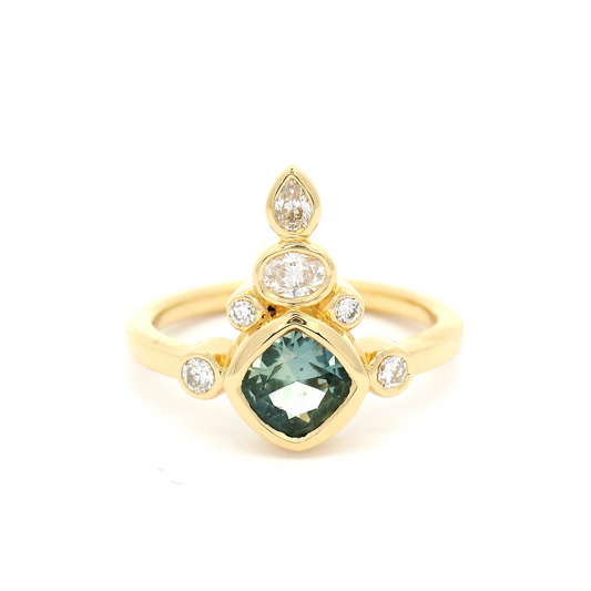 18k yellow ring 0.68ct teal sapphire and fancy shape accent diamonds.