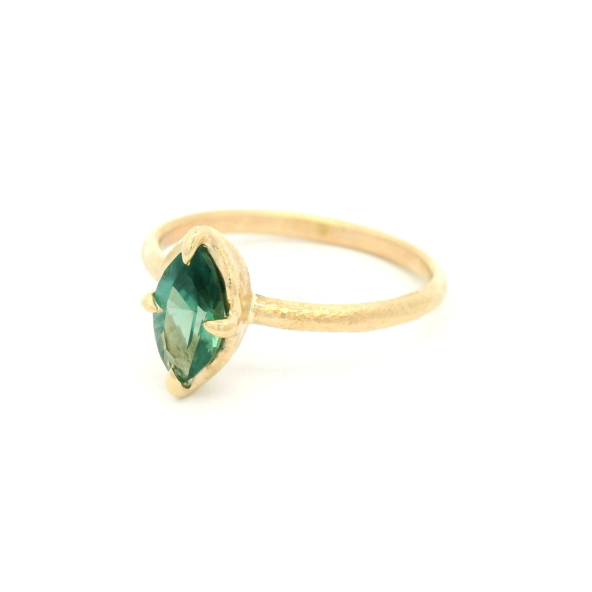 10K yellow gold delicate organic solitaire engagement ring with a claw-set 1.00ct lab-grown marquise green sapphire.