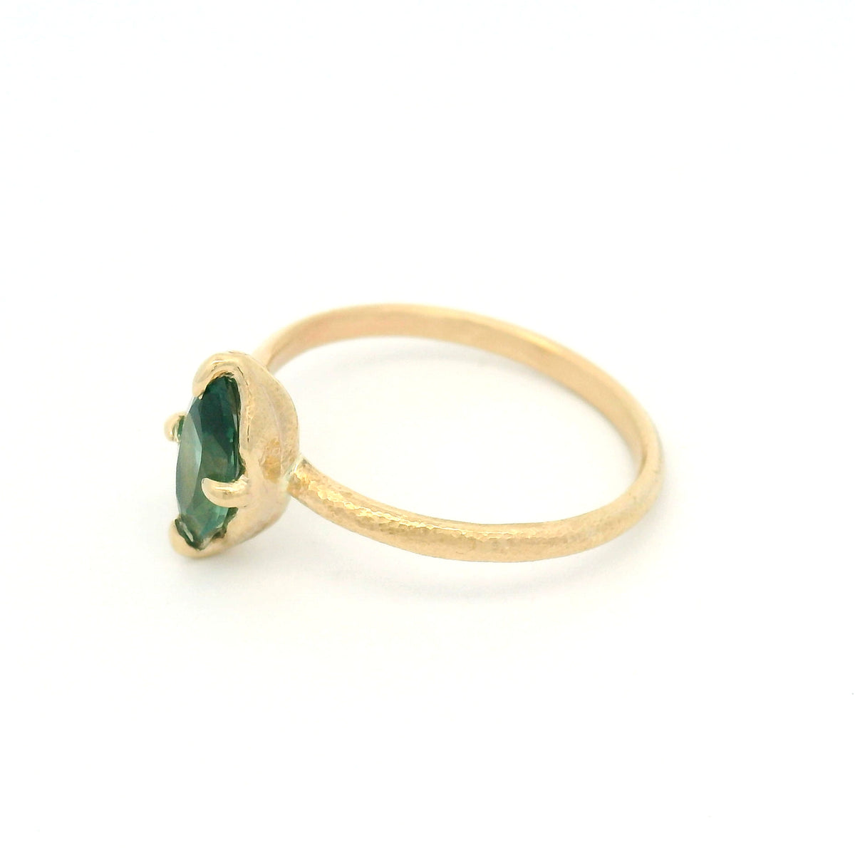 10K yellow gold delicate organic solitaire engagement ring with a claw-set 1.00ct lab-grown marquise green sapphire.