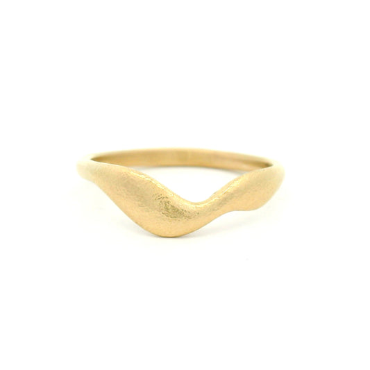 10K yellow gold wedding band with an organic textured surface and wobbly asymmetrical profile featuring free-flowing, sculptural contours.