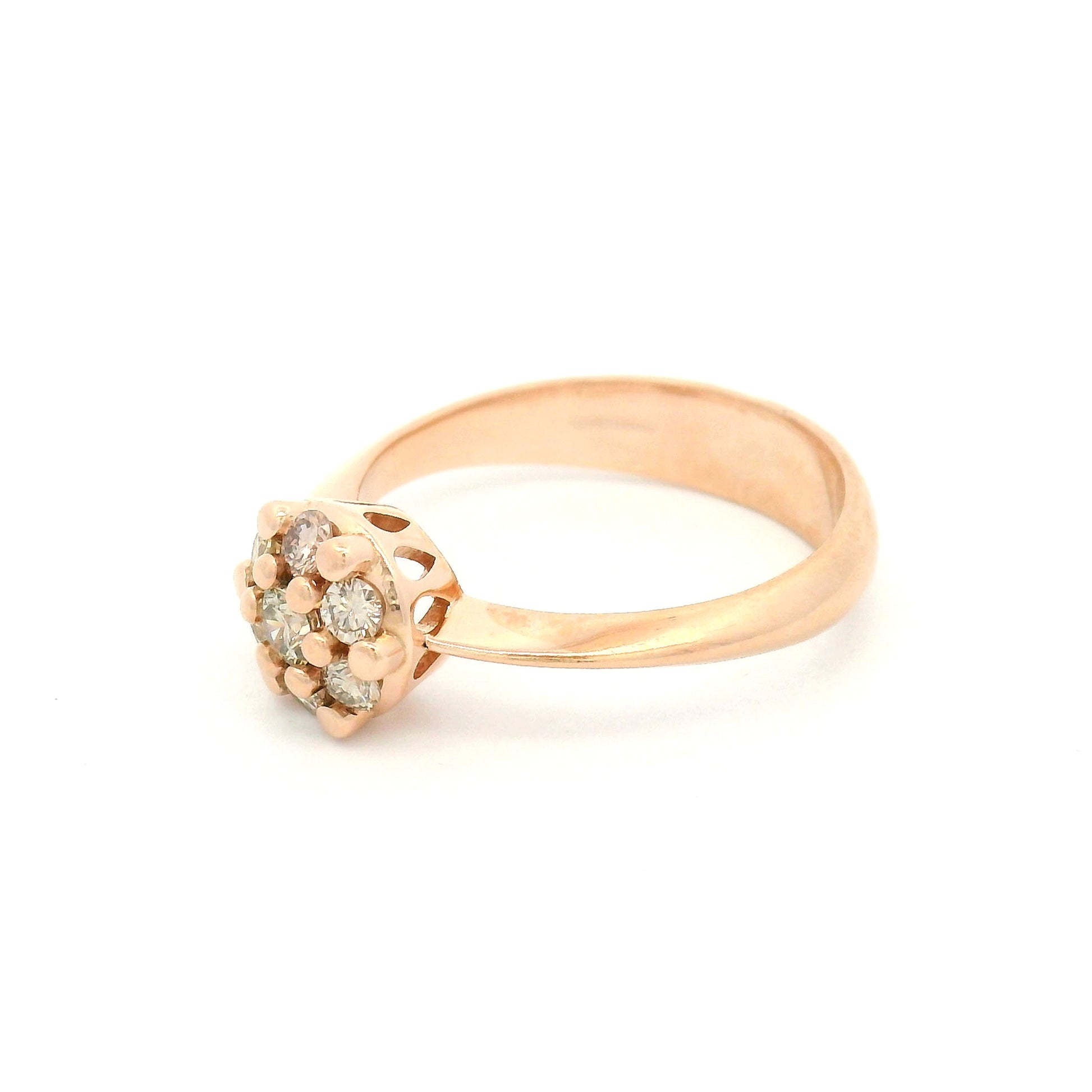 14K rose gold engagement ring with a floral-inspired cluster of seven claw-set round brilliant champagne-coloured diamonds measuring just over 7mm.