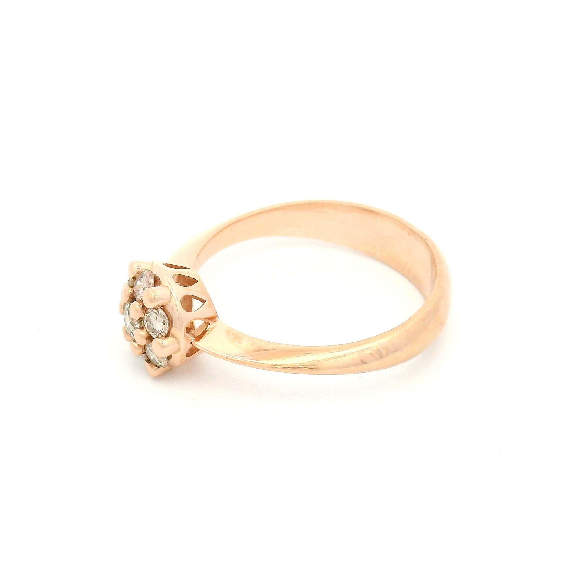 14K rose gold engagement ring with a floral-inspired cluster of seven claw-set round brilliant champagne-coloured diamonds measuring just over 7mm.