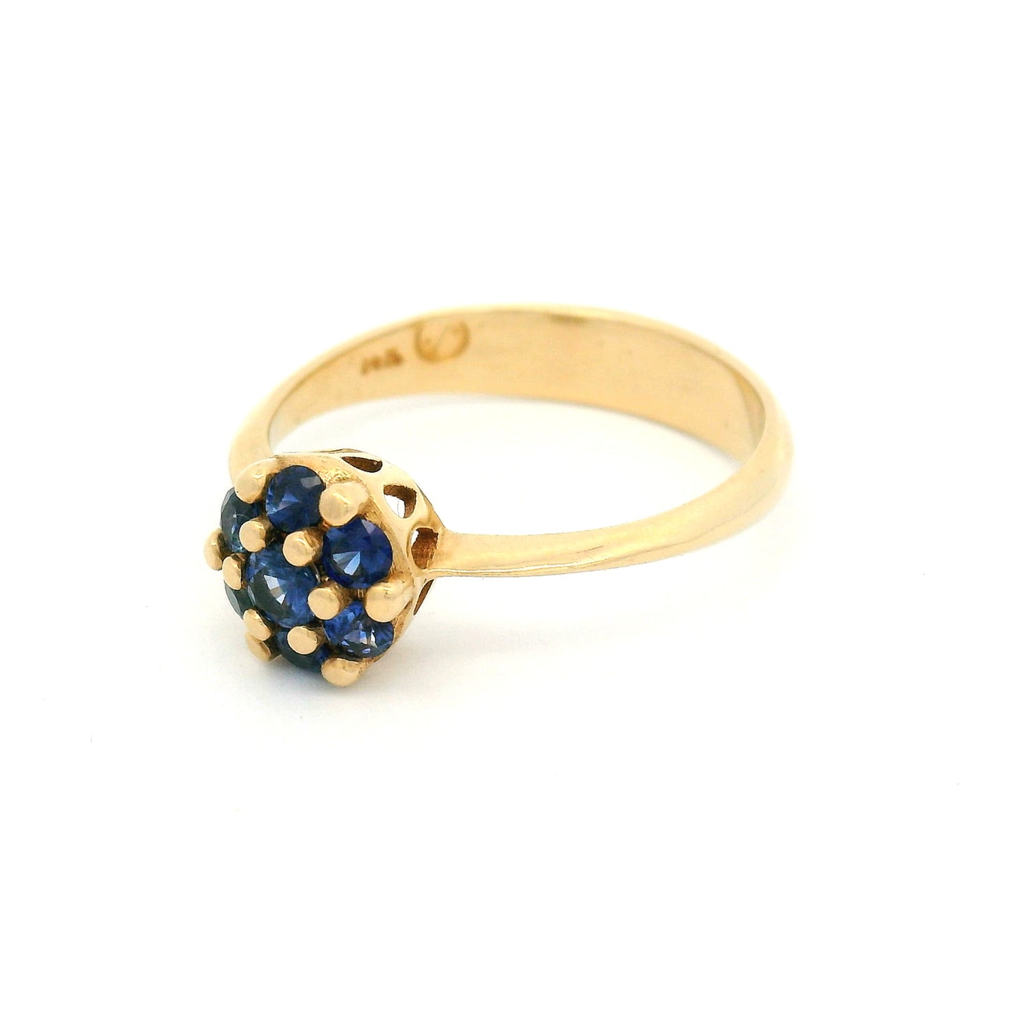 14K yellow gold engagement ring with a cluster of seven claw-set round blue sapphires measuring just over 7mm.