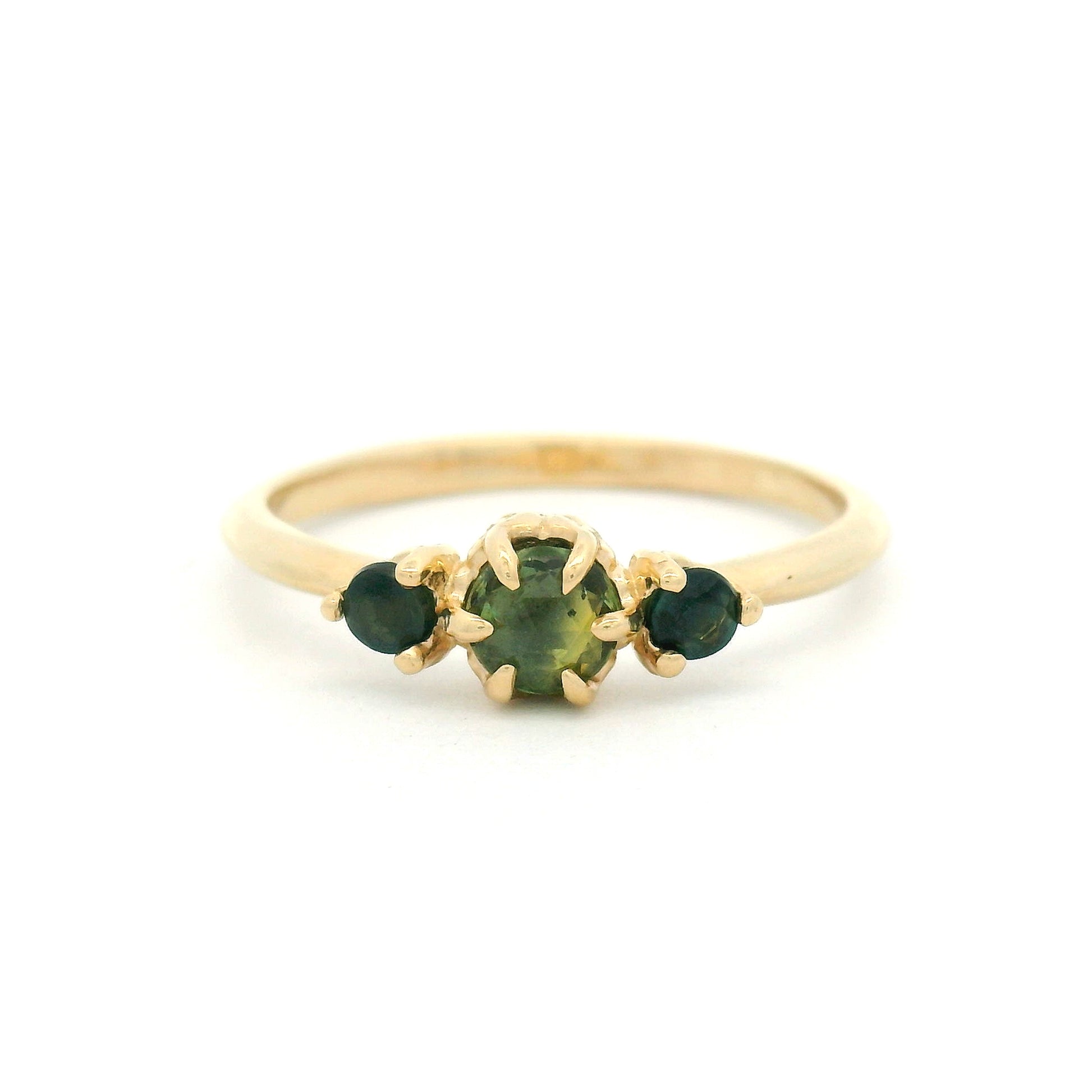 14K yellow gold organic three-stone ring with 0.38cts of natural green sapphires set in carved leaf-inspired settings.
