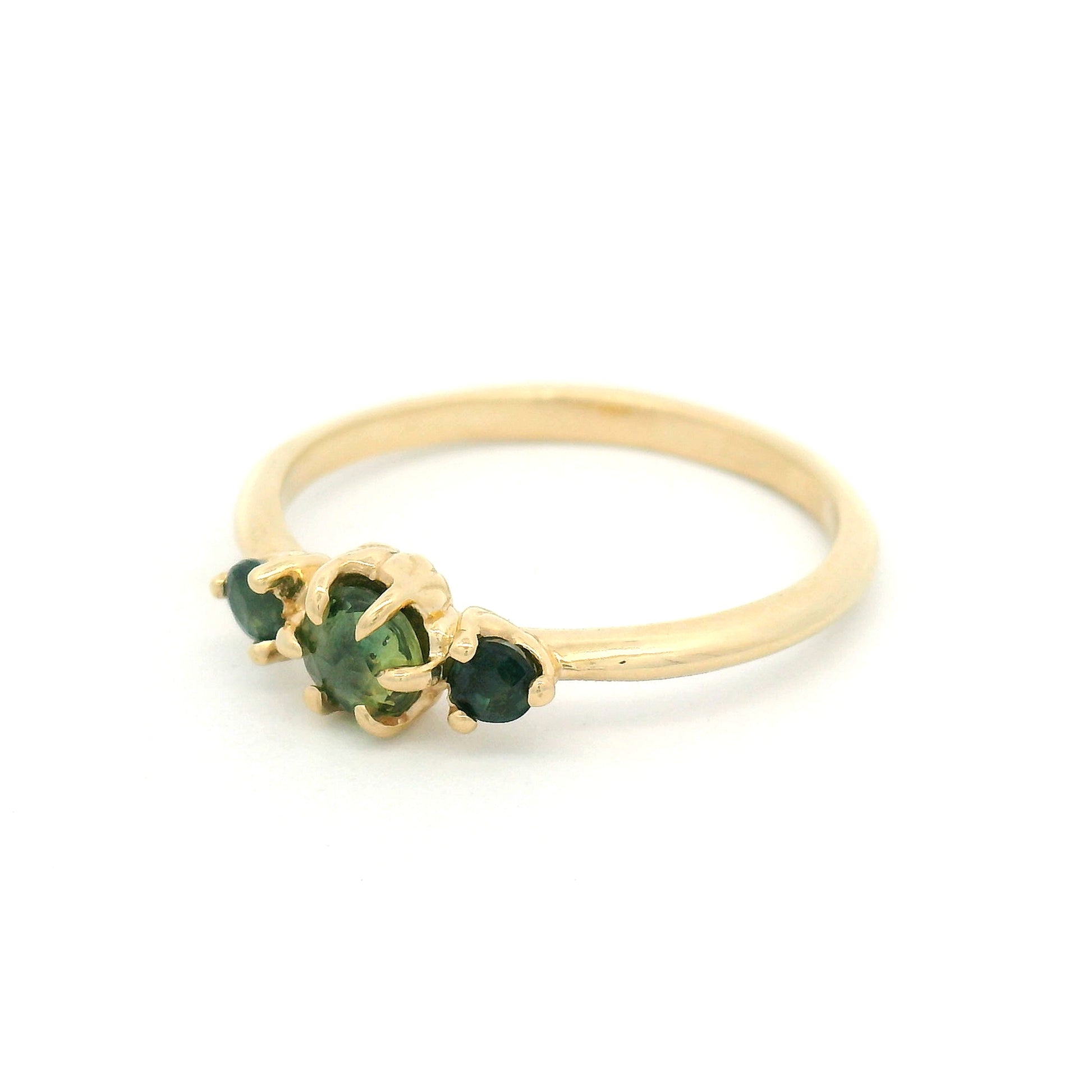 14K yellow gold organic three-stone ring with 0.38cts of natural green sapphires set in carved leaf-inspired settings.