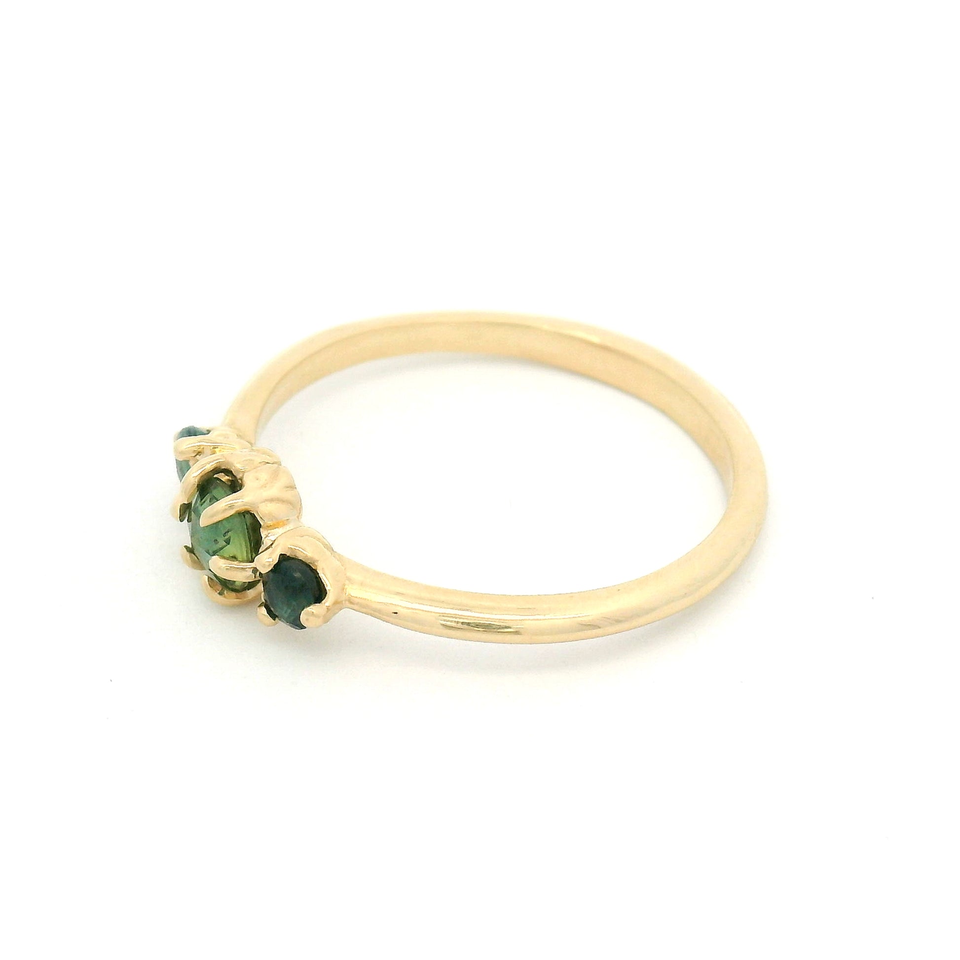 14K yellow gold organic three-stone ring with 0.38cts of natural green sapphires set in carved leaf-inspired settings.