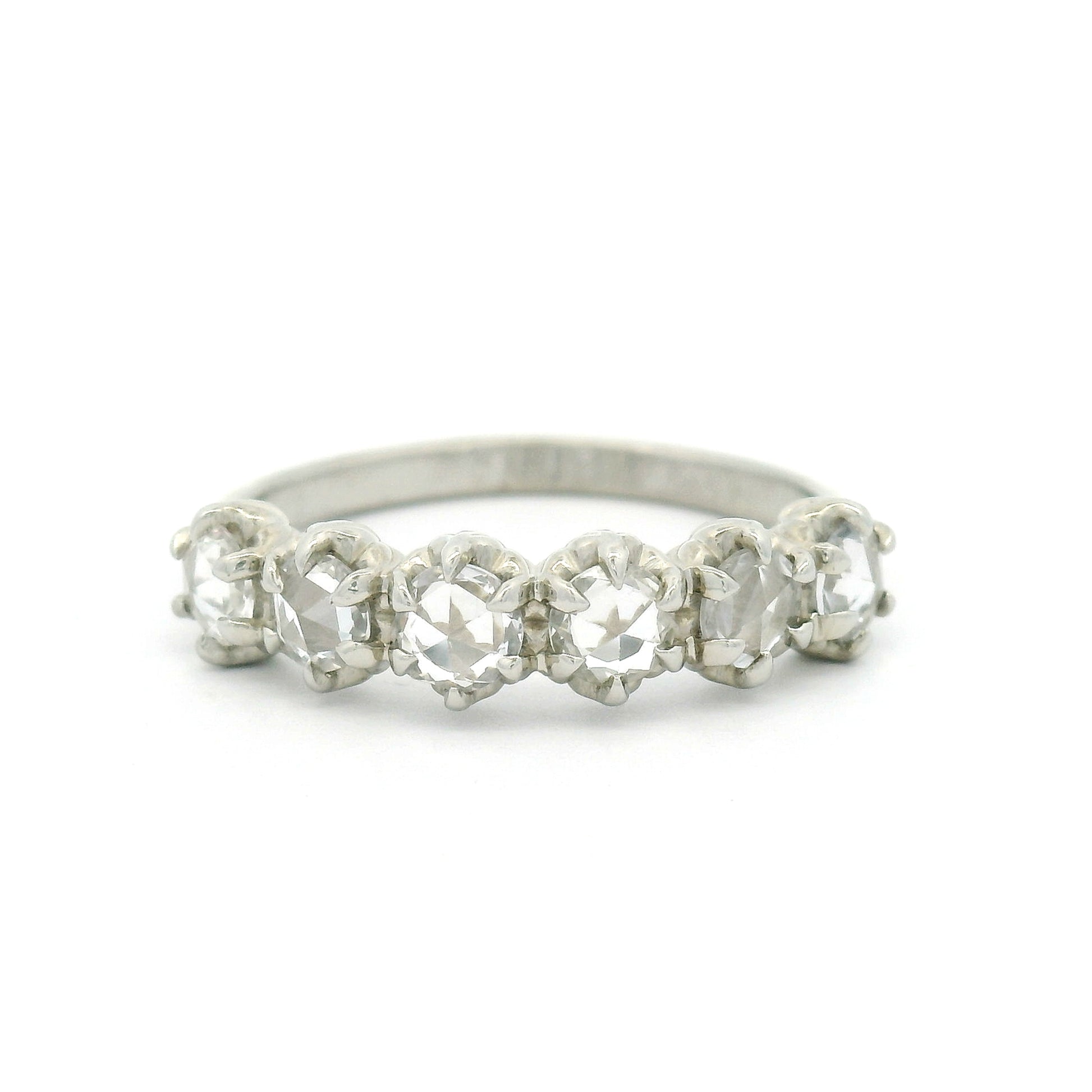 14K white gold six-stone band with six claw-set 3.5mm round rose-cut white sapphires on a softly domed 2mm band.