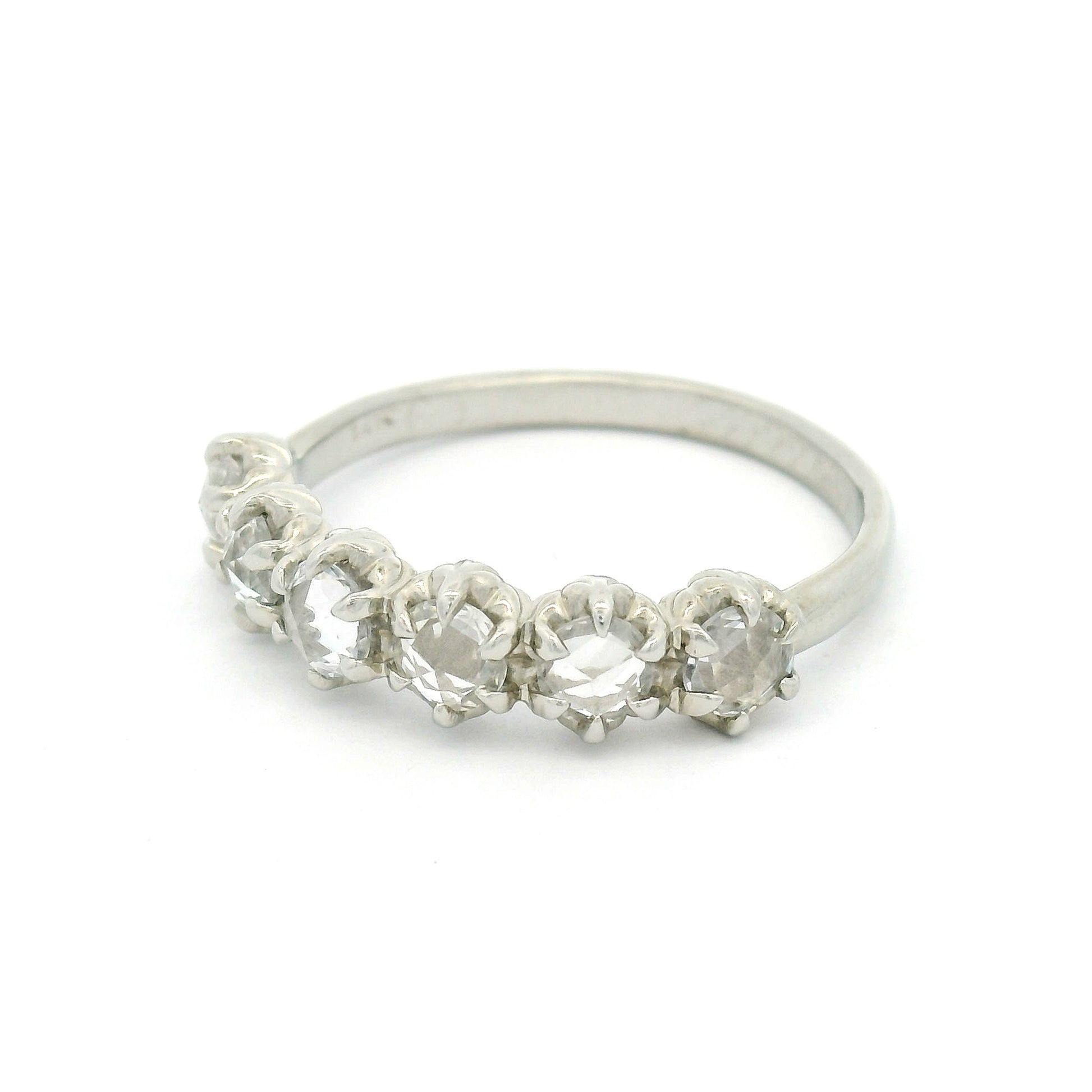 14K white gold six-stone band with six claw-set 3.5mm round rose-cut white sapphires on a softly domed 2mm band.