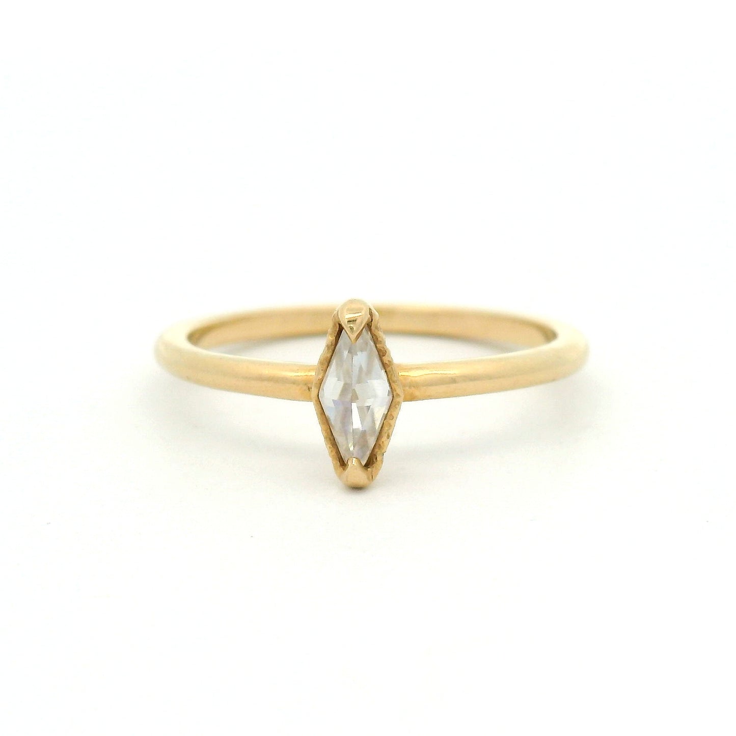 14K yellow gold solitaire ring featuring a 0.15ct diamond-shaped rose-cut moissanite, organic textured gallery, and polished 1.7mm soft domed band.