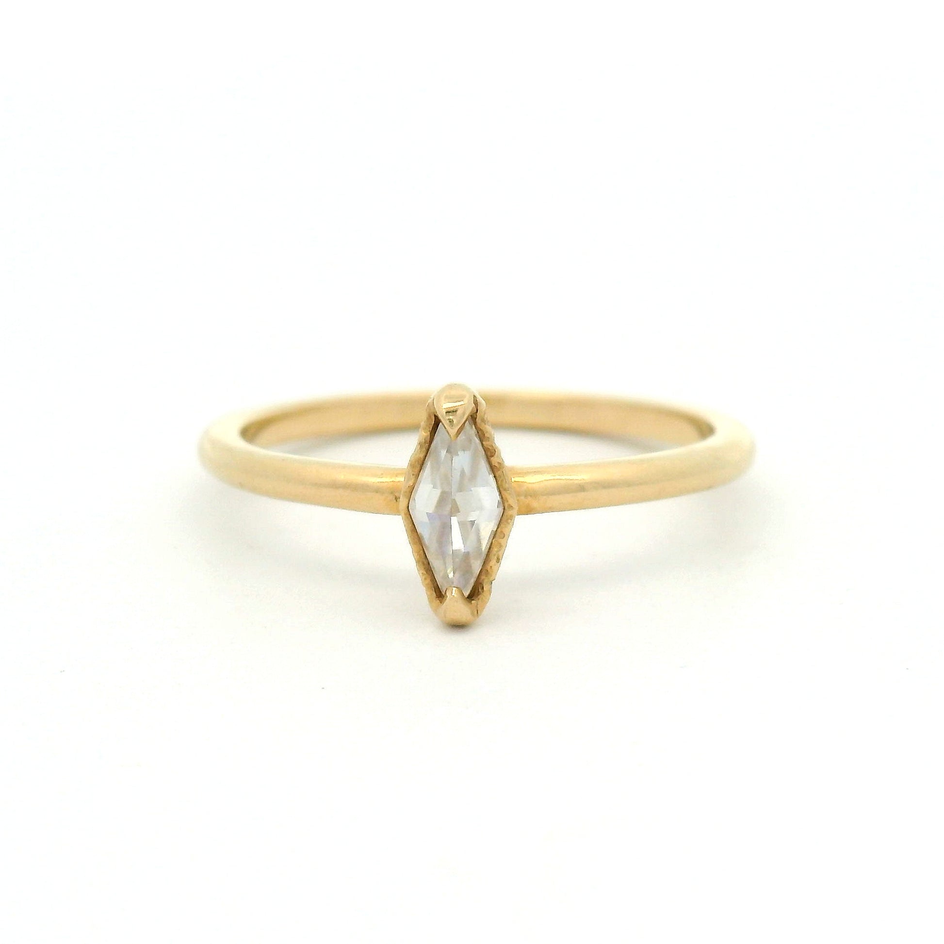 14K yellow gold solitaire ring featuring a 0.15ct diamond-shaped rose-cut moissanite, organic textured gallery, and polished 1.7mm soft domed band.