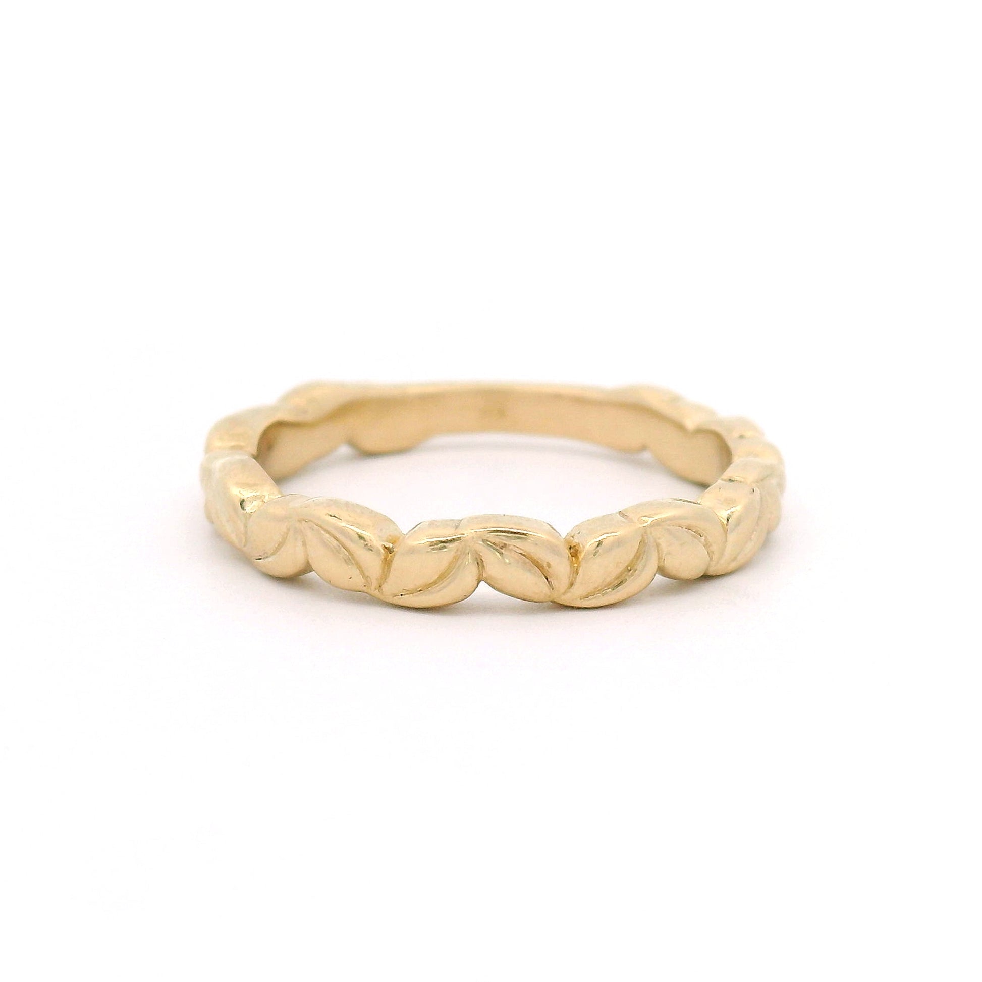 10K yellow gold 3mm wedding band with an intricately carved leaf pattern and nature-inspired botanical detailing.