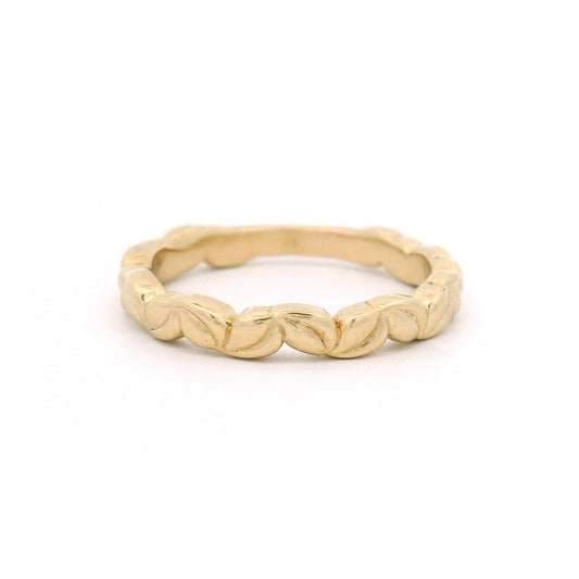 10K yellow gold 3mm wedding band with an intricately carved leaf pattern and nature-inspired botanical detailing.