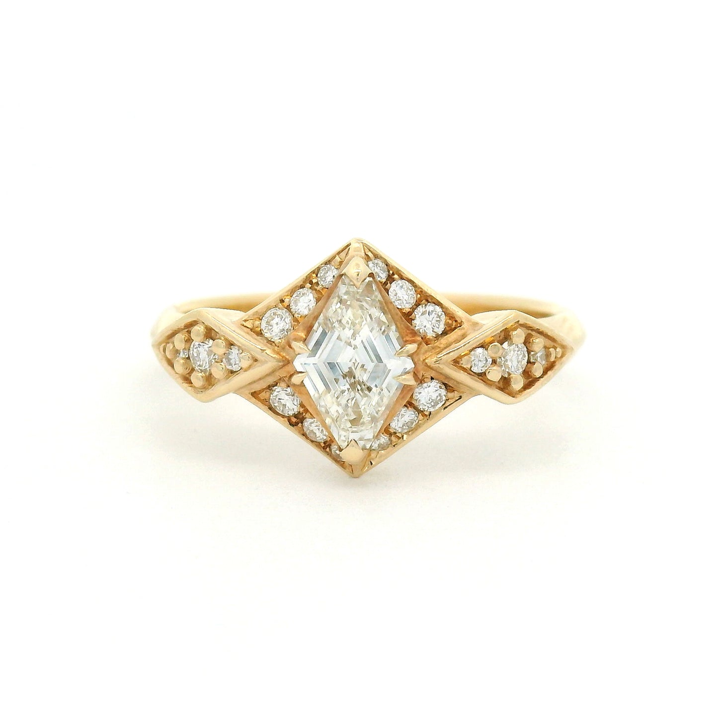 14K yellow gold engagement ring featuring a 0.53ct Canadian diamond and 0.22cts of accent diamonds in an elegant multi-stone design.