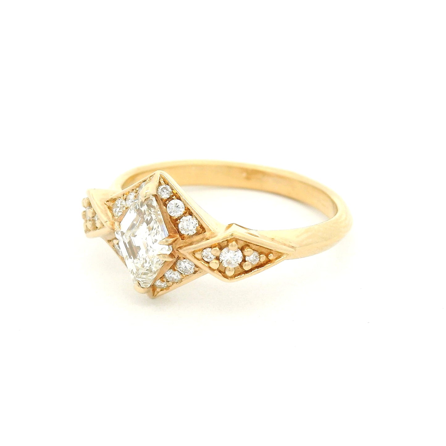 14K yellow gold engagement ring featuring a 0.53ct Canadian diamond and 0.22cts of accent diamonds in an elegant multi-stone design.