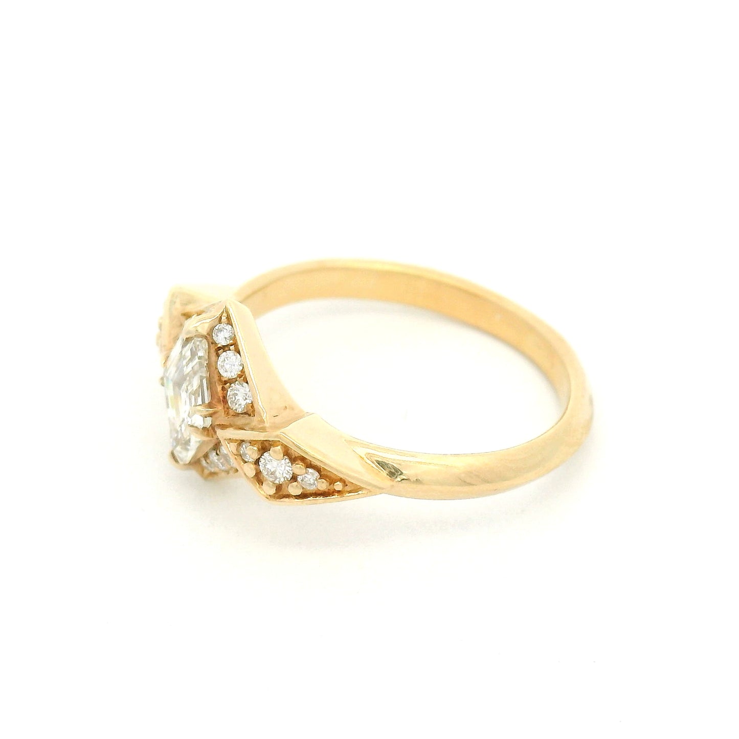 14K yellow gold engagement ring featuring a 0.53ct Canadian diamond and 0.22cts of accent diamonds in an elegant multi-stone design.