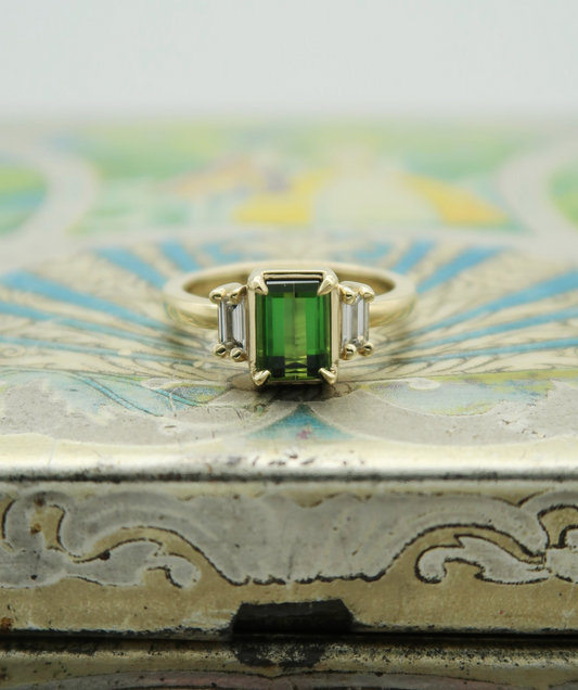 10k Yellow Green Tourmaline Ring with Baguette Diamond Accents.