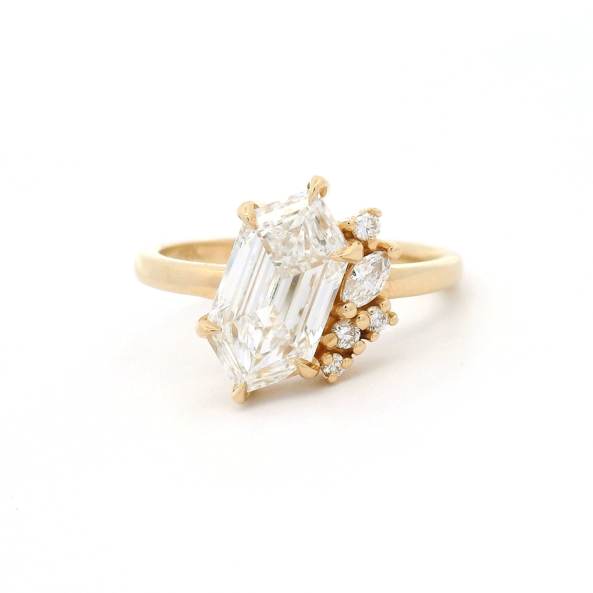 14K yellow gold engagement ring featuring a 2.03ct lab-grown Dutch marquise-cut diamond with an asymmetrical cluster of five mixed-cut lab-grown diamond accents on a delicate 1.8mm band.