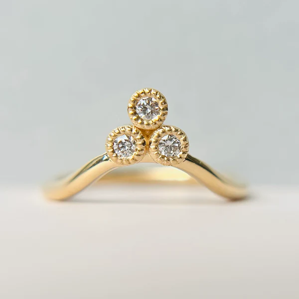 14k Yellow Contoured Band with a Colourless Diamond Trio.