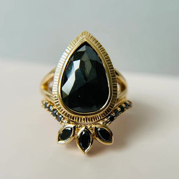 14k Yellow Contoured Band with 3 Black Marquise Diamonds and 10 Black Accent Diamonds.  Displayed with a engagement ring.  