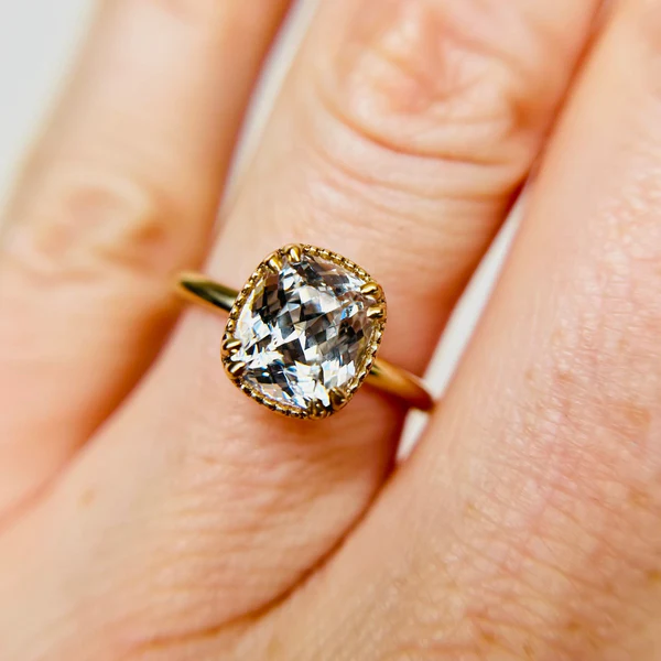 2.68ct Icy Sapphire set in hand crafted 14K yellow gold.  Worn on hand.