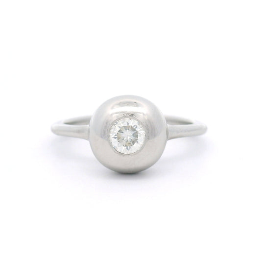 Platinum bezel-set solitaire ring with a natural 0.30ct round brilliant-cut diamond, I1 clarity, K colour, rounded dome and 1.5mm band.