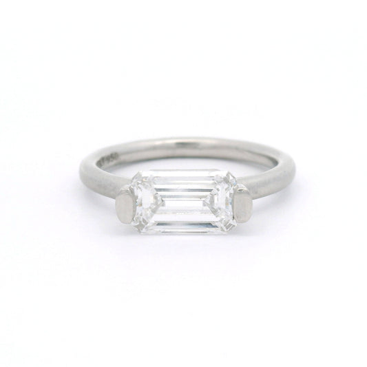 Platinum bar-set solitaire engagement ring with a 1.58ct lab-grown emerald-cut diamond, VVS1 clarity, D colour and rounded 2mm satin band.