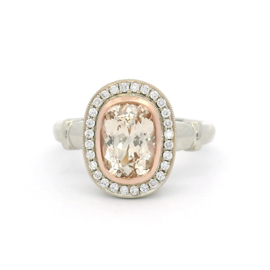 18K white gold engagement ring with a 14K rose gold bezel, natural 1.95ct cushion-cut peach sapphire, 28 natural diamonds and wire undergallery details.
