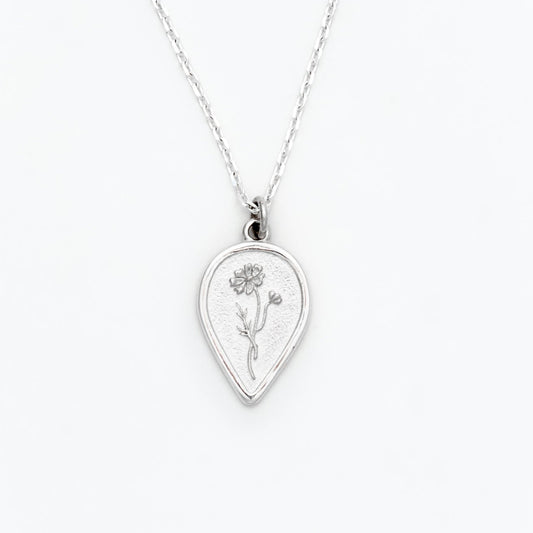 Silver necklace with a teardrop-shaped pendant on a white background