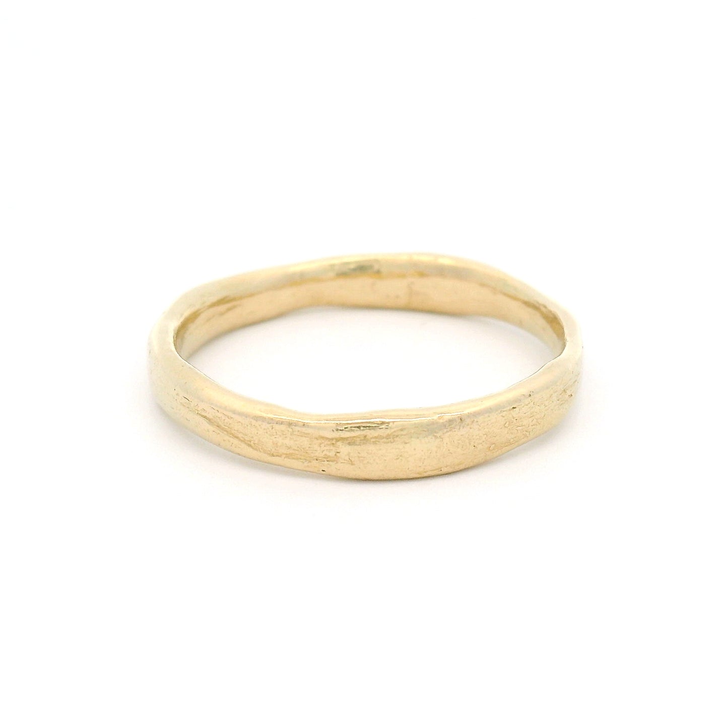 10K yellow gold 3.5mm wedding band featuring a soft organic texture, gently domed profile, and polished comfort-fit interior.