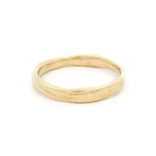 10K yellow gold 3.5mm wedding band featuring a soft organic texture, gently domed profile, and polished comfort-fit interior.