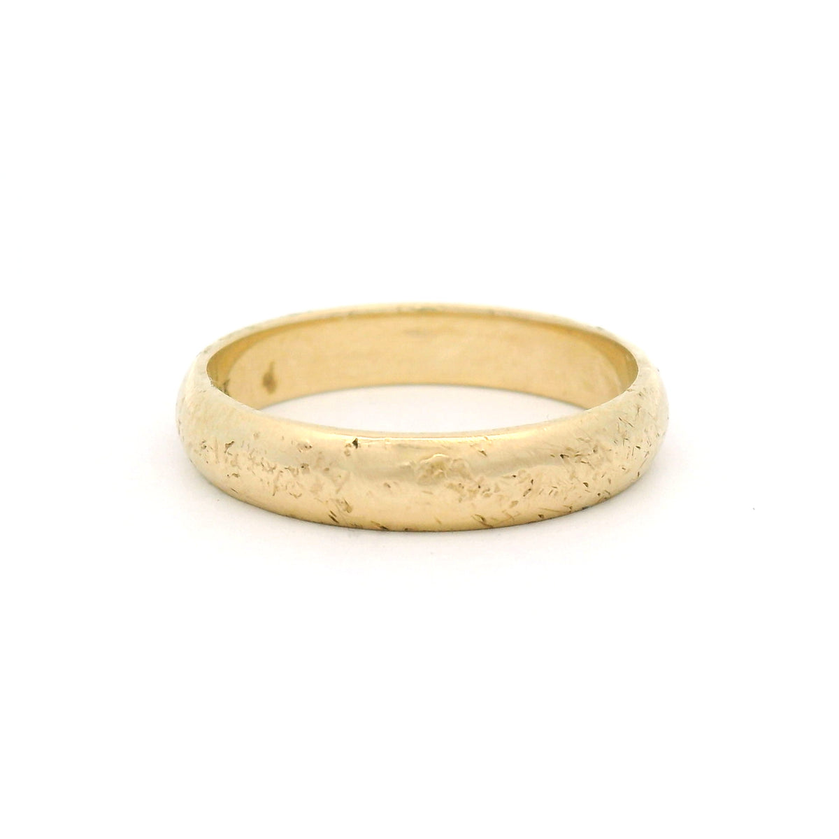 10K yellow gold 4mm wedding band featuring a softly domed profile, straight edges and a rough organic textured finish.