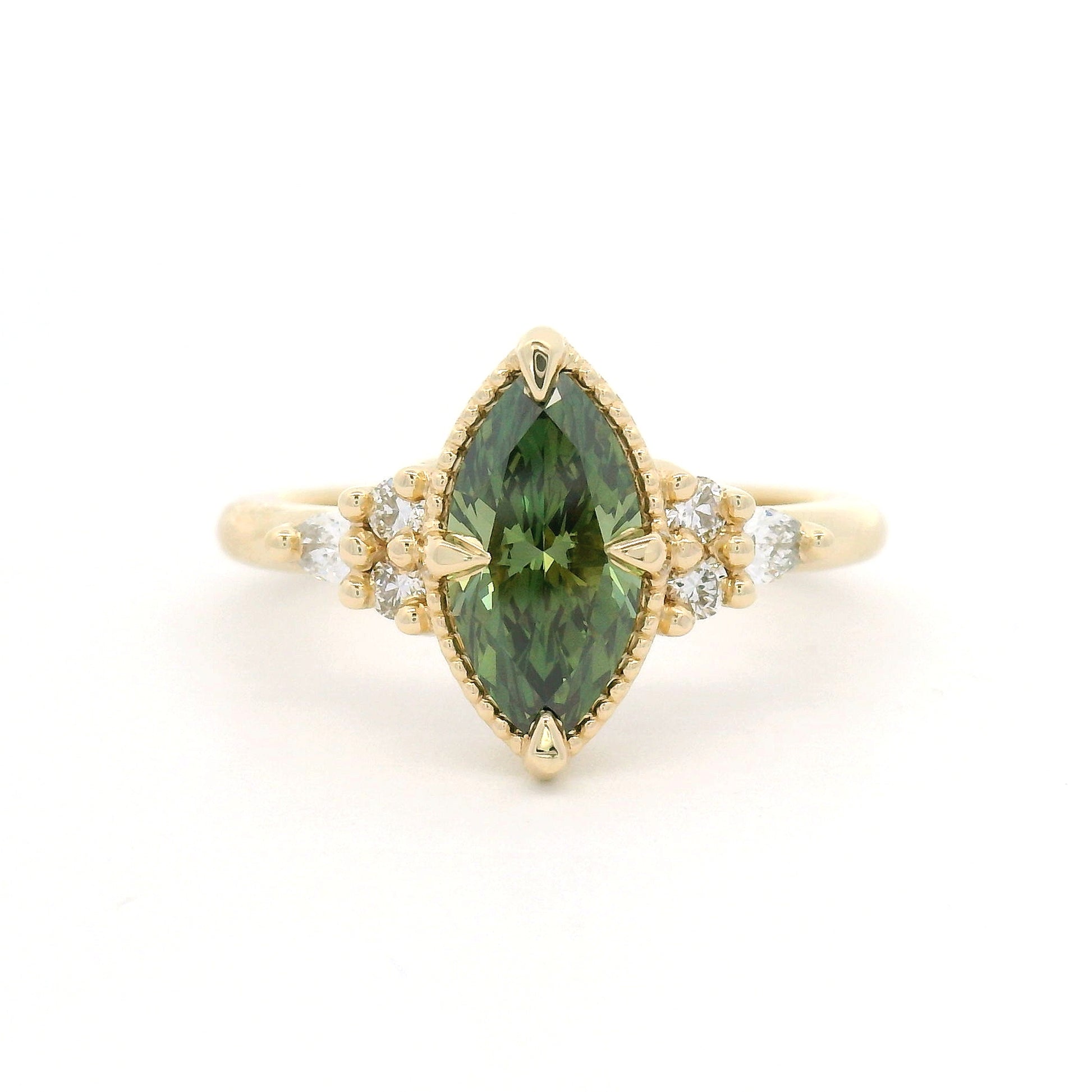 14K yellow gold engagement ring featuring a claw-set 1.01ct lab-grown Fancy Vivid Green marquise diamond with a milgrain edge and six lab-grown diamond accents totalling 0.19cts.