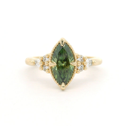 14K yellow gold engagement ring featuring a claw-set 1.01ct lab-grown Fancy Vivid Green marquise diamond with a milgrain edge and six lab-grown diamond accents totalling 0.19cts.