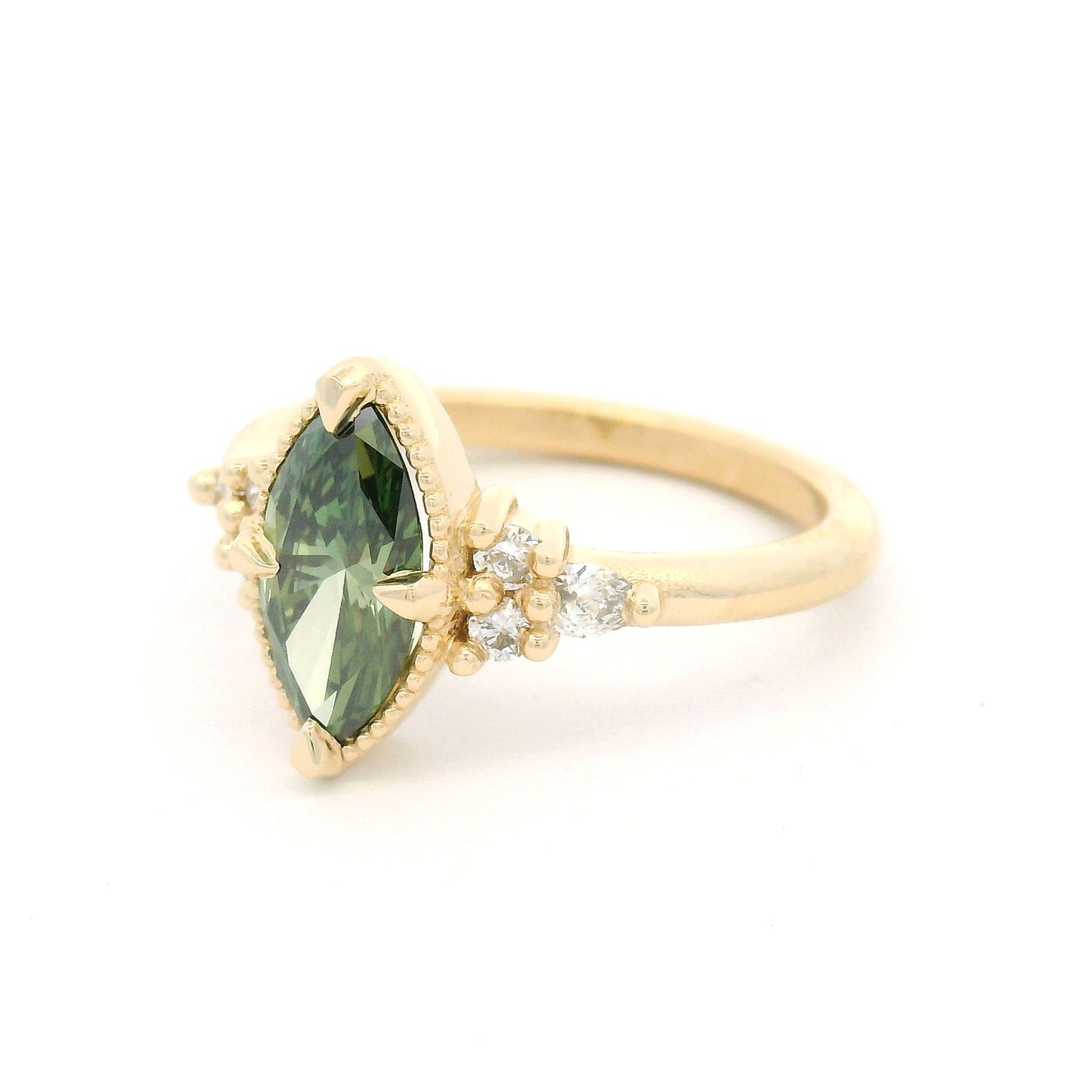14K yellow gold engagement ring featuring a claw-set 1.01ct lab-grown Fancy Vivid Green marquise diamond with a milgrain edge and six lab-grown diamond accents totalling 0.19cts.