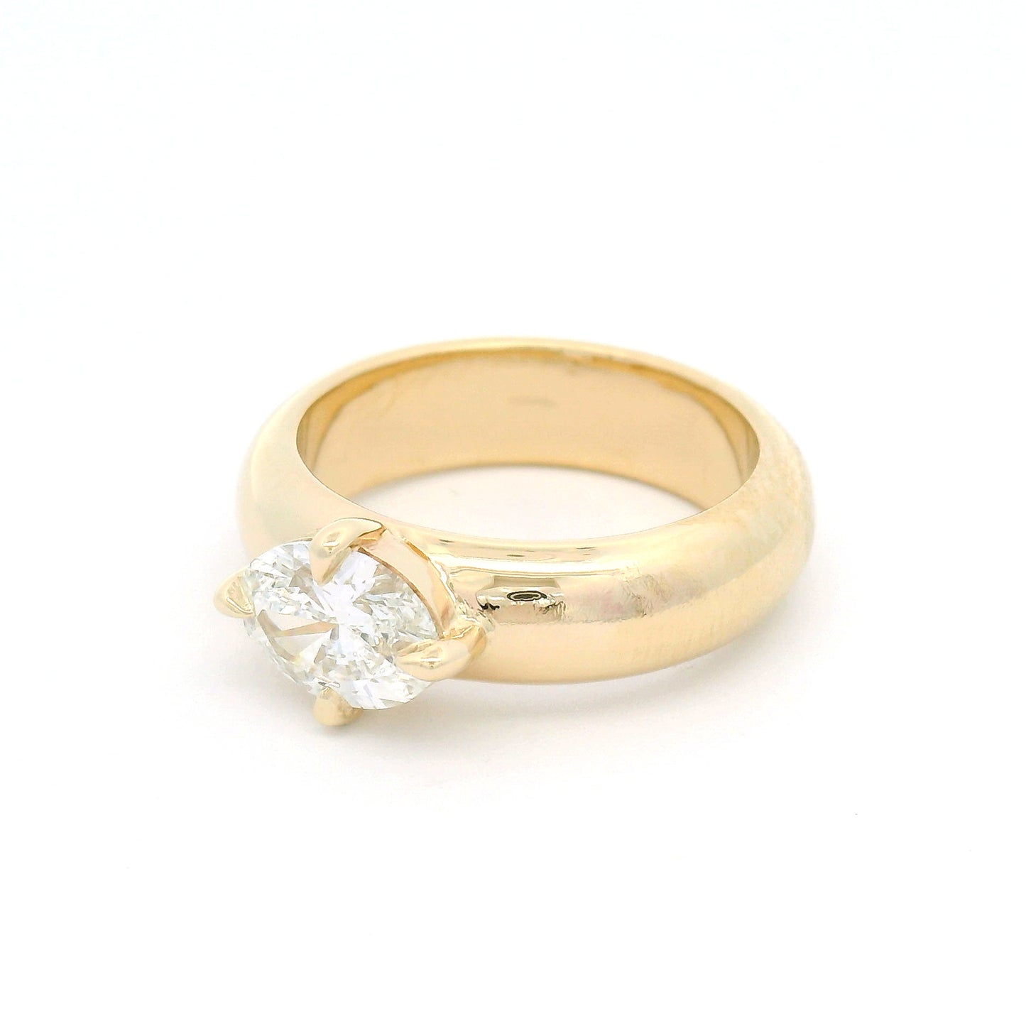 14K yellow gold solitaire engagement ring with a claw-set 1.02ct oval brilliant-cut lab-grown diamond on a softly domed band.