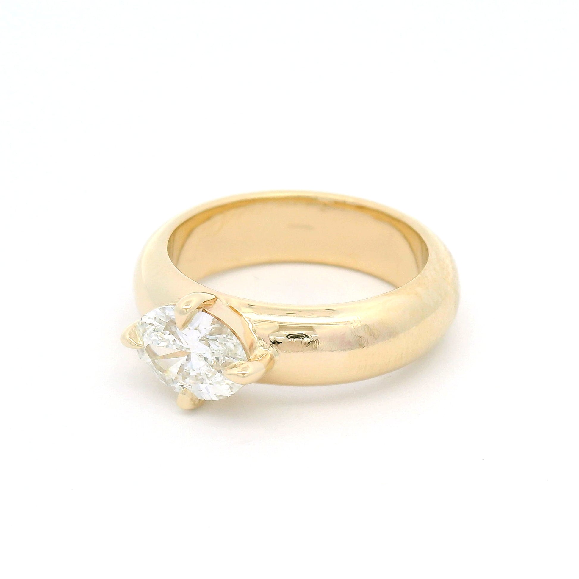 14K yellow gold solitaire engagement ring with a claw-set 1.02ct oval brilliant-cut lab-grown diamond on a softly domed band.