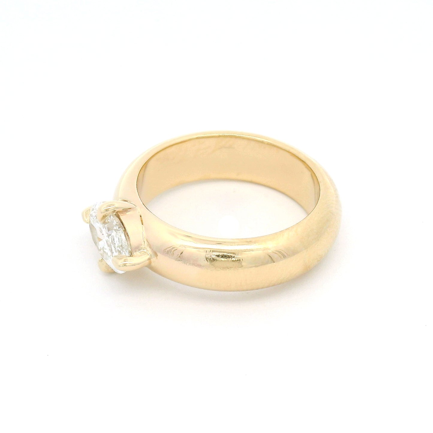 14K yellow gold solitaire engagement ring with a claw-set 1.02ct oval brilliant-cut lab-grown diamond on a softly domed band.