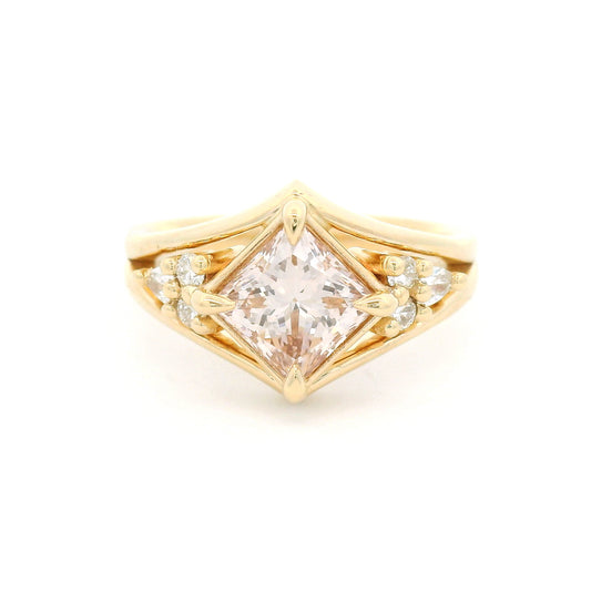 14K yellow gold engagement ring featuring a 1.49ct lab-grown Fancy Pink Brownish princess-cut diamond in a kite orientation, split shank, and 0.19cts of lab-grown diamond accents.