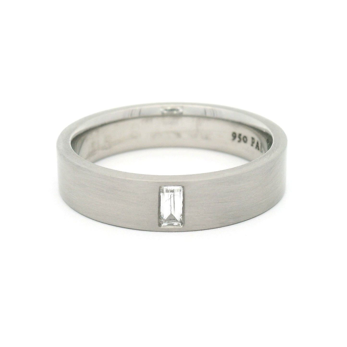 5mm 950 palladium comfort-fit band with a flat brushed finish and flush-set 0.12ct lab-grown baguette-cut diamond.