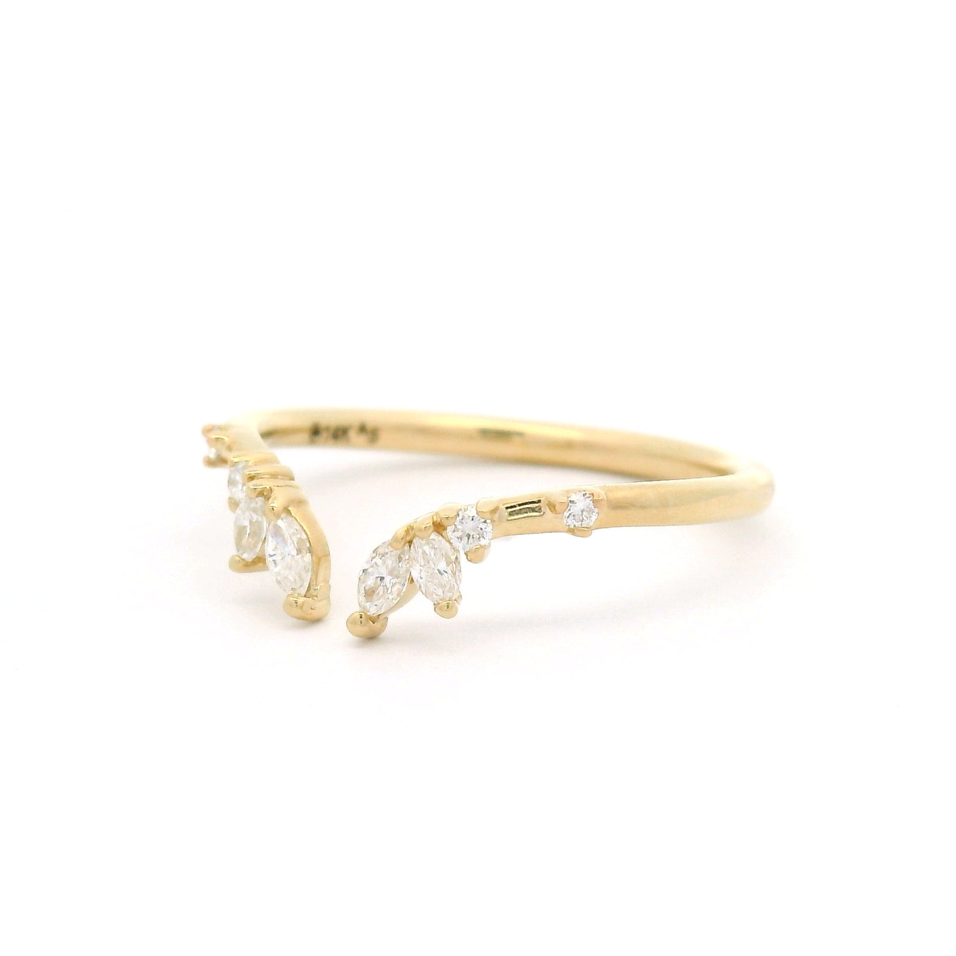 14K yellow gold contoured open band set with marquise and round white diamonds.